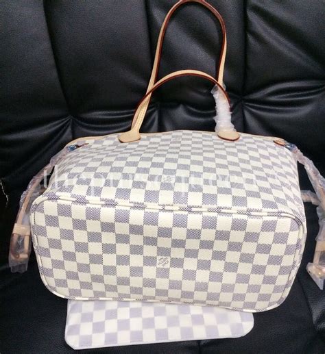 spot fake louis vuitton neverfull damier ebene|false louis vuitton neverfull bag.